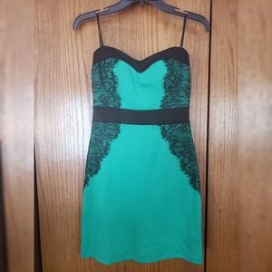 Bright green and black strapless mini dress